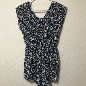 Navy romper with white floral pattern